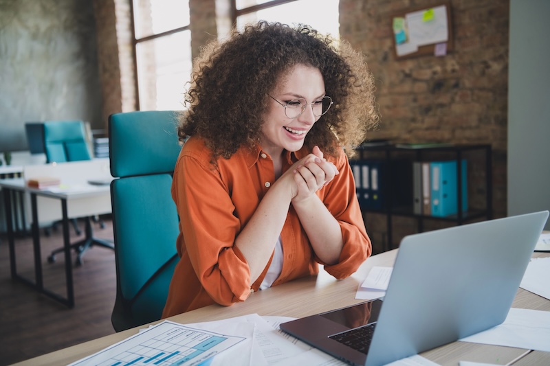 Professional working at a laptop, reclaiming time with AI-enabled workflows